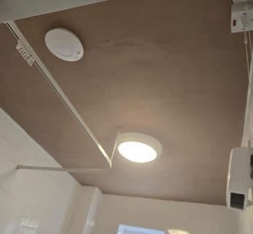 Bathroom ceiling repaired and freshly skimmed with fan and light refitted