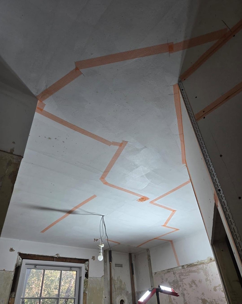 New plasterboard ceiling with joints scrim-taped before skim